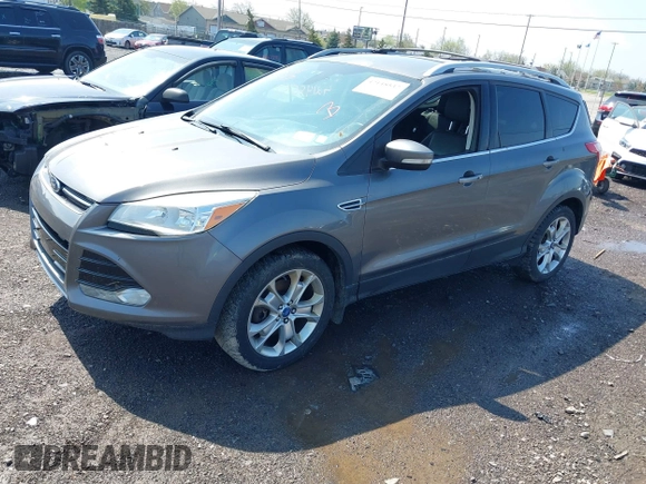 2014 Ford Escape Titanium with VIN 1FMCU9J99EUA75276, listed as a IAAI auction lot 42148537 with 163,330 mi miles and . Bid and sale history available at DreamBid. Image 2.