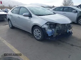 2018 Toyota Corolla L z VIN 5YFBURHE2JP831394, wystawiony jako IAAI lot #41689172 z przebiegiem 74 985 mil mil oraz . Historia ofert i sprzedaży dostępna na DreamBid. Obrazek 1.