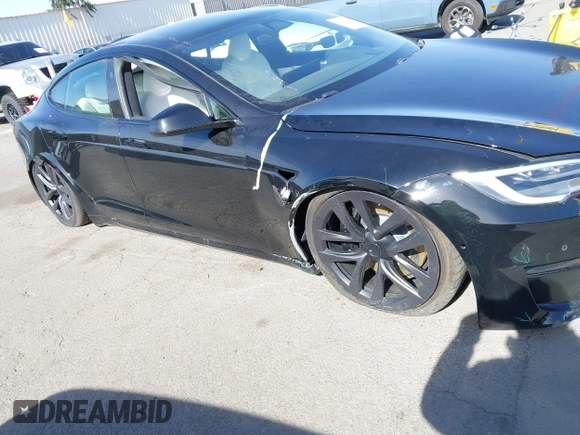 2022 Tesla Model S Plaid with VIN 5YJSA1E62NF460634, listed as a IAAI auction lot 41372644 with 16,050 mi miles and . Bid and sale history available at DreamBid. Image 6.