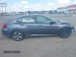 2020 Honda Civic LX with VIN 2HGFC2F65LH505932, listed as a IAAI auction lot 40046863 with 59,768 mi miles and . Bid and sale history available at DreamBid. Image 14.