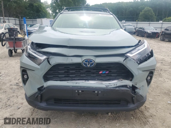 2023 Toyota RAV4 Hybrid XLE Premium with VIN JTMB6RFV8PD097109, listed as a Copart auction lot 59970995 with 43,197 mi miles and Salvage title. Bid and sale history available at DreamBid. Image 5.