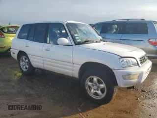 1999 Toyota RAV4 with VIN JT3GP10V7X7063436, listed as a Copart auction lot 42700055 with 159,001 mi miles and Salvage Title. Bid and sale history available at DreamBid. Image 4.