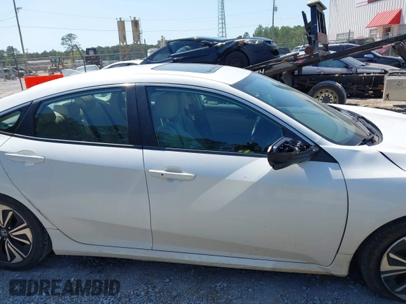 2018 Honda Civic EX-L with VIN 19XFC1F72JE002269, listed as a IAAI auction lot 41973885 with 130,979 mi miles and . Bid and sale history available at DreamBid. Image 14.