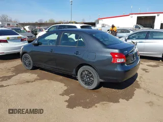 2009 Toyota Yaris with VIN JTDBT903194047784, listed as a IAAI auction lot 42049872 with 115,735 mi miles. Bid and sale history available at carsss.com. Image 3.