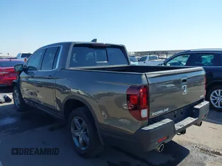 2022 Honda Ridgeline RTL with VIN 5FPYK3F58NB007618, listed as a IAAI auction lot 42258443 with 14,036 mi miles and . Bid and sale history available at DreamBid. Image 3.