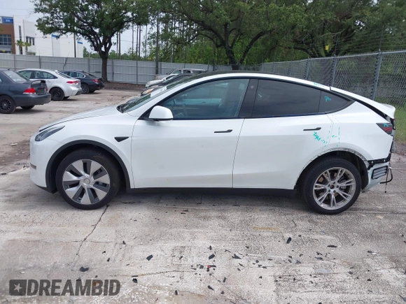 2023 Tesla Model Y Long Range z VIN 7SAYGDEE0PA065534, wystawiony jako IAAI lot #42445868 z przebiegiem 22 638 mil mil oraz . Historia ofert i sprzedaży dostępna na DreamBid. Obrazek 14.