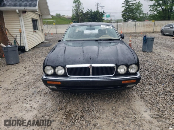 1997 Jaguar XJ with VIN SAJHX6248VC806189, listed as a Copart auction lot 57891035 with 51,654 mi miles and Salvage title. Bid and sale history available at DreamBid. Image 5.