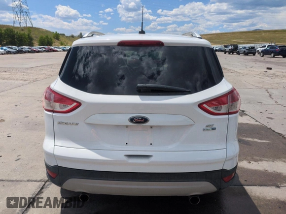 2013 Ford Escape SE with VIN 1FMCU9GX9DUD12210, listed as a Copart auction lot 62496095 with 77,516 mi miles and Salvage title. Bid and sale history available at DreamBid. Image 6.