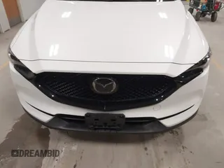 2020 Mazda CX-5 Grand Touring with VIN JM3KFBDM6L1828611, listed as a IAAI auction lot 42006976 with 59,939 mi miles and . Bid and sale history available at DreamBid. Image 13.