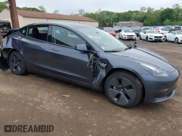 2023 Tesla Model 3 with VIN 5YJ3E1EA9PF673399, listed as a IAAI auction lot 42392643 with 7,571 mi miles and . Bid and sale history available at DreamBid. Image 1.