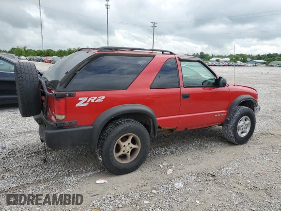 1999 Chevrolet Blazer LS с VIN 1GNCT18W3XK150385, выставлен на аукционе Copart как лот 58490985 с пробегом 262 007 миль миль и Списание • Salvage title. История ставок и продаж доступна на DreamBid. Изображение 3.