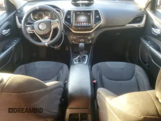 2016 Jeep Cherokee Latitude with VIN 1C4PJLCBXGW221848, listed as a Copart auction lot 51090945 with 216,945 mi miles and Salvage title. Bid and sale history available at DreamBid. Image 8.