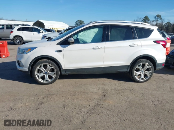 2019 Ford Escape Titanium with VIN 1FMCU9J91KUB21842, listed as a IAAI auction lot 41632210 with 104,900 mi miles. Bid and sale history available at carsss.com. Image 14.