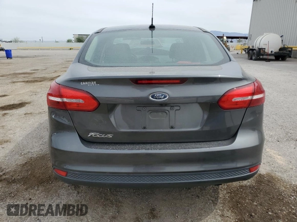 2017 Ford Focus S z VIN 1FADP3E21HL304026, wystawiony jako Copart lot #58786875 z przebiegiem 68 092 mil mil oraz Szkoda całkowita • Salvage title. Historia ofert i sprzedaży dostępna na DreamBid. Obrazek 6.