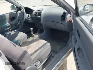 2005 Hyundai Accent GLS with VIN KMHCG35C65U332999, listed as a IAAI auction lot 42097932 with 225,593 mi miles. Bid and sale history available at carsss.com. Image 5.