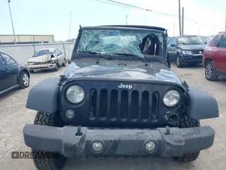 2015 Jeep Wrangler Freedom Edition with VIN 1C4AJWAG4FL681688, listed as a IAAI auction lot 42488018 with Not provided miles and . Bid and sale history available at DreamBid. Image 12.