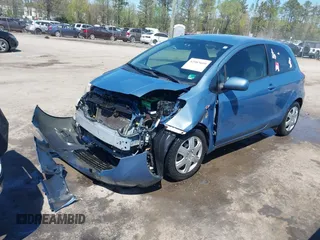 2010 Toyota Yaris with VIN JTDJT4K36A5285298, listed as a IAAI auction lot 42003609 with 158,418 mi miles. Bid and sale history available at carsss.com. Image 2.