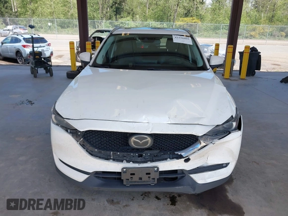 2020 Mazda CX-5 Grand Touring with VIN JM3KFBDM2L0863944, listed as a IAAI auction lot 42150805 with 63,932 mi miles and . Bid and sale history available at DreamBid. Image 12.
