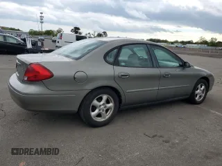2002 Ford Taurus SE Standard z VIN 1FAFP53U92A246842, wystawiony jako Copart lot #57858765 z przebiegiem 64 545 mil mil oraz Tytuł czysty. Historia ofert i sprzedaży dostępna na DreamBid. Obrazek 3.