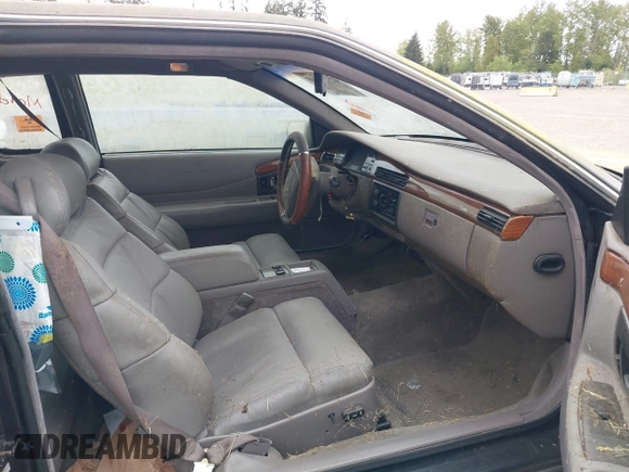 1992 Cadillac Eldorado z VIN 1G6EL13B0NU605624, wystawiony jako IAAI lot #42127549 z przebiegiem Nie podano mil oraz . Historia ofert i sprzedaży dostępna na DreamBid. Obrazek 5.