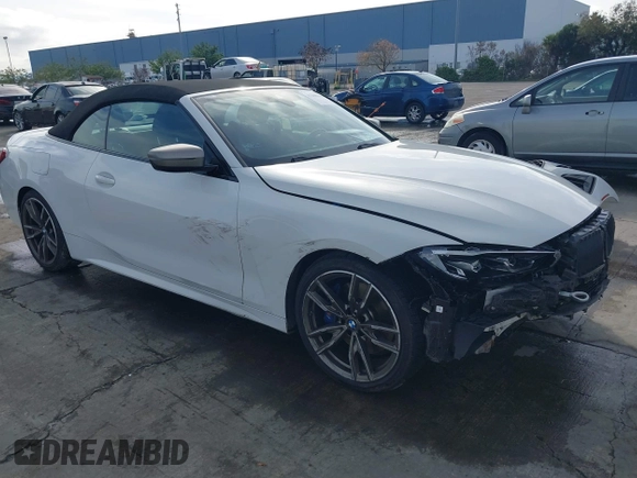 2022 BMW 4 Series M440i with VIN WBA53AT02NCJ20674, listed as a IAAI auction lot 41200398 with 28,235 mi miles and . Bid and sale history available at DreamBid. Image 1.