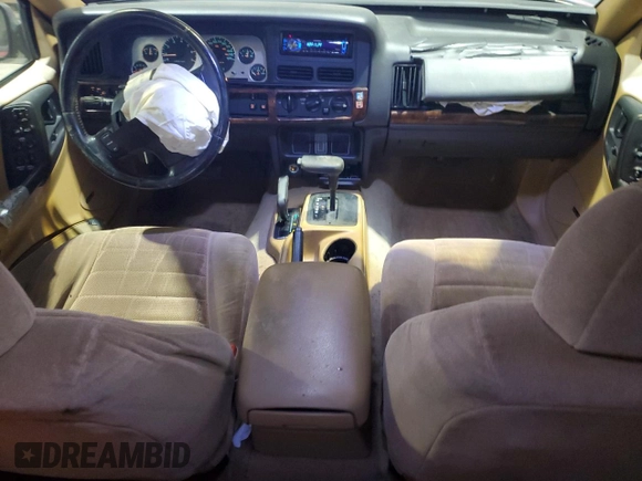 1997 Jeep Grand Cherokee Laredo with VIN 1J4GZ58Y5VC674687, listed as a Copart auction lot 43137095 with 173,228 mi miles and Salvage Title. Bid and sale history available at carsss.com. Image 8.