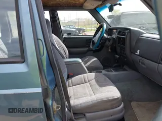 1998 Jeep Cherokee Sport with VIN 1J4FJ68S0WL269553, listed as a IAAI auction lot 42207389 with 261,377 mi miles and . Bid and sale history available at DreamBid. Image 5.