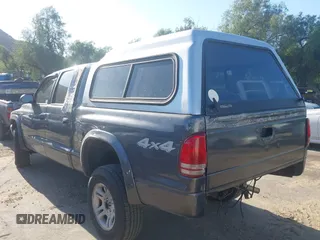 2003 Dodge Dakota SLT with VIN 1D7HG48N33S248568, listed as a IAAI auction lot 41834084 with 153,001 mi miles and . Bid and sale history available at DreamBid. Image 3.