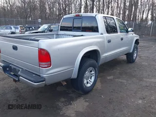 2002 Dodge Dakota Sport with VIN 1B7HG38N12S661043, listed as a IAAI auction lot 41552725 with 206,662 mi miles. Bid and sale history available at carsss.com. Image 4.