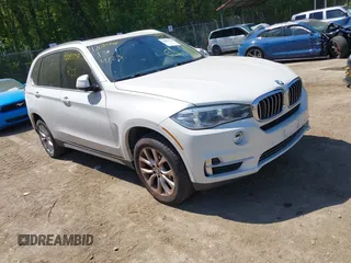 2014 BMW X5 xDrive35i z VIN 5UXKR0C50E0H20073, wystawiony jako IAAI lot #42091738 z przebiegiem 142 400 mil mil oraz . Historia ofert i sprzedaży dostępna na DreamBid. Obrazek 1.