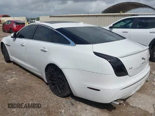2014 Jaguar XJ R with VIN SAJWA1EK3EMV58692, listed as a IAAI auction lot 42663979 with 111,386 mi miles and . Bid and sale history available at DreamBid. Image 3.