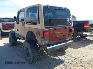 2001 Jeep Wrangler Sahara with VIN 1J4FA59S71P326941, listed as a IAAI auction lot 41648420 with 128,464 mi miles. Bid and sale history available at carsss.com. Image 3.