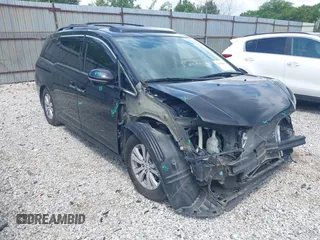 2014 Honda Odyssey Touring with VIN 5FNRL5H96EB100420, listed as a IAAI auction lot 42514610 with 106,564 mi miles and . Bid and sale history available at DreamBid. Image 1.