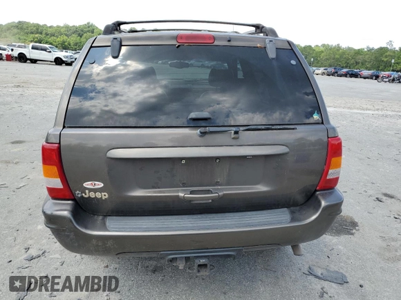 1999 Jeep Grand Cherokee Limited with VIN 1J4GW68S6XC713297, listed as a Copart auction lot 55264384 with 98,912 mi miles and Salvage Title. Bid and sale history available at carsss.com. Image 6.