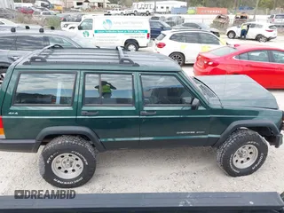 1999 Jeep Cherokee Sport with VIN 1J4FF68S1XL555463, listed as a IAAI auction lot 41898076 with 206,656 mi miles. Bid and sale history available at carsss.com. Image 13.