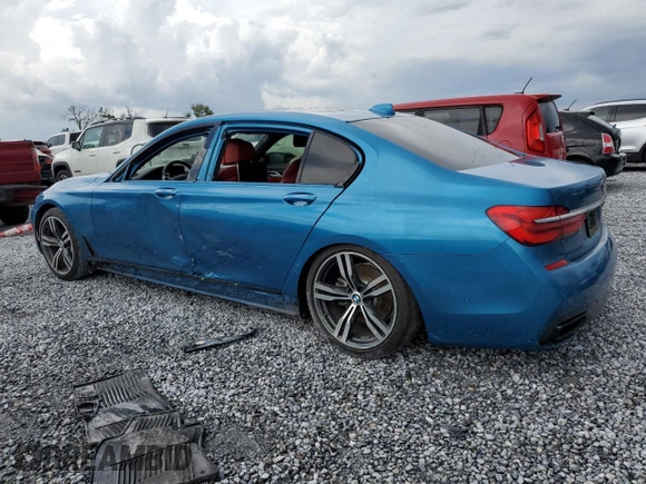 2019 BMW 7 Series 750i z VIN WBA7F0C51KGM25707, wystawiony jako Copart lot #61950495 z przebiegiem 56 768 mil mil oraz Nie do naprawy • Non repairable. Historia ofert i sprzedaży dostępna na DreamBid. Obrazek 2.