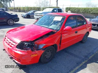 2003 Hyundai Accent GL with VIN KMHCG45C93U487209, listed as a IAAI auction lot 41590636 with 118,811 mi miles. Bid and sale history available at carsss.com. Image 2.