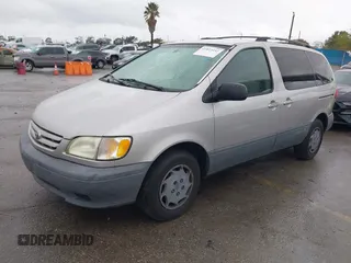 2002 Toyota Sienna CE with VIN 4T3ZF19C02U493816, listed as a IAAI auction lot 41813141 with 216,915 mi miles. Bid and sale history available at carsss.com. Image 2.