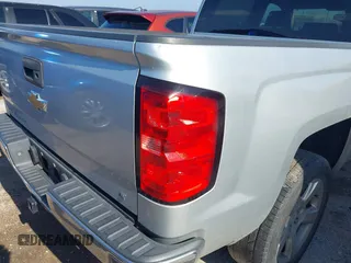 2015 Chevrolet Silverado 1500 LT with VIN 3GCPCREH0FG152809, listed as a IAAI auction lot 41573835 with 213,410 mi miles and . Bid and sale history available at DreamBid. Image 6.
