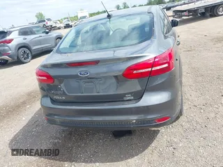 2018 Ford Focus SE z VIN 1FADP3FE5JL228583, wystawiony jako IAAI lot #42313614 z przebiegiem 84 240 mil mil oraz . Historia ofert i sprzedaży dostępna na DreamBid. Obrazek 16.