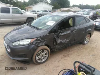 2018 Ford Fiesta SE z VIN 3FADP4BJ6JM126135, wystawiony jako IAAI lot #42503766 z przebiegiem 14 836 mil mil oraz . Historia ofert i sprzedaży dostępna na DreamBid. Obrazek 2.