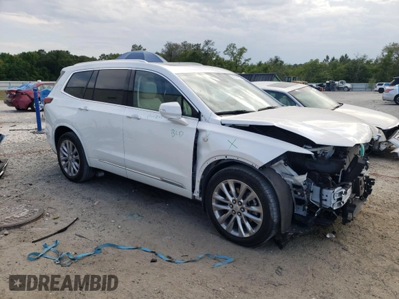 2023 Cadillac XT6 FWD Premium Luxury with VIN 1GYKPCRS5PZ120161, listed as a Copart auction lot 54614235 with 39,700 mi miles and Salvage title. Bid and sale history available at DreamBid. Image 4.