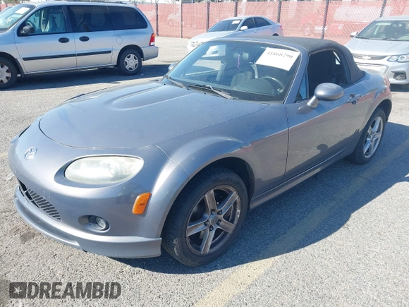 2006 Mazda MX-5 Miata Touring z VIN JM1NC25F960112536, wystawiony jako IAAI lot #41868290 z przebiegiem 153 162 mil mil oraz . Historia ofert i sprzedaży dostępna na DreamBid. Obrazek 2.