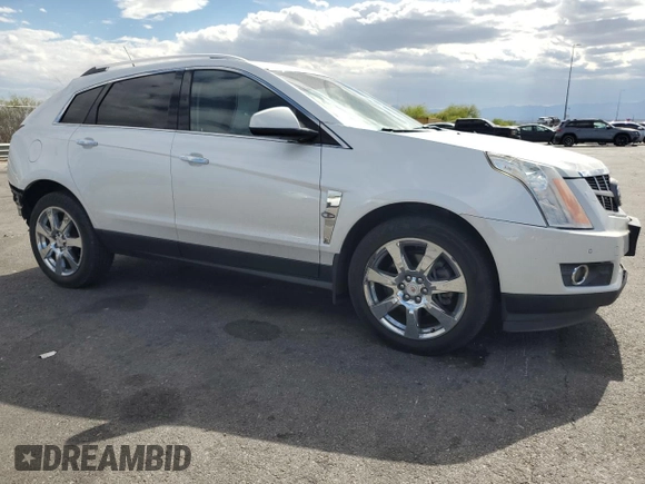 2012 Cadillac SRX Performance Collection with VIN 3GYFNBE33CS540914, listed as a Copart auction lot 54787125 with 130,357 mi miles and Salvage title. Bid and sale history available at DreamBid. Image 4.