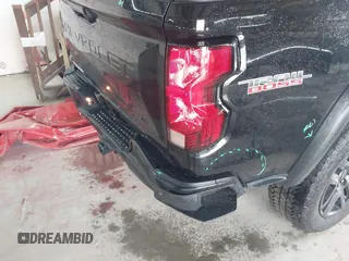 2023 Chevrolet Colorado 4WD Trail Boss with VIN 1GCPTEEK3P1261771, listed as a IAAI auction lot 42535710 with 30,000 mi miles and . Bid and sale history available at DreamBid. Image 6.