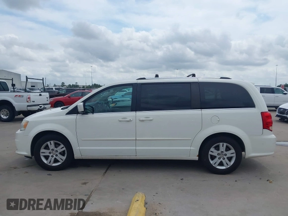 2011 Dodge Grand Caravan Crew with VIN 2D4RN5DGXBR786592, listed as a IAAI auction lot 42114198 with 243,423 mi miles and . Bid and sale history available at DreamBid. Image 14.