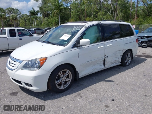 2008 Honda Odyssey Touring with VIN 5FNRL38858B006304, listed as a IAAI auction lot 41814309 with 208,778 mi miles. Bid and sale history available at carsss.com. Image 2.
