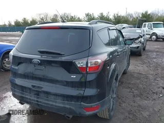 2017 Ford Escape SE with VIN 1FMCU0GD4HUA76833, listed as a IAAI auction lot 41642460 with 116,435 mi miles. Bid and sale history available at carsss.com. Image 4.