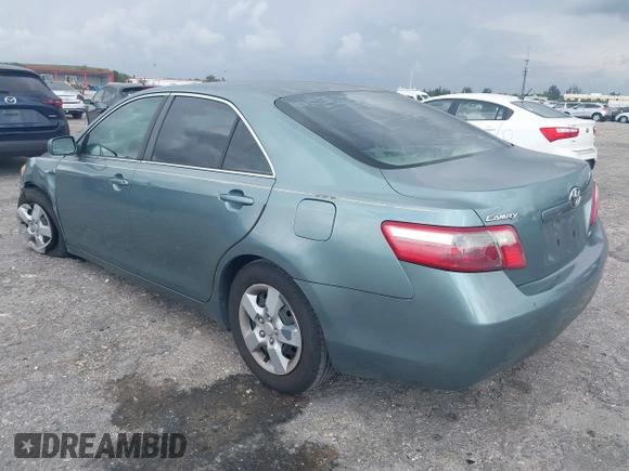 2007 Toyota Camry CE with VIN 4T1BE46K37U569515, listed as a IAAI auction lot 41974482 with 242,042 mi miles. Bid and sale history available at carsss.com. Image 3.