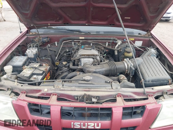 2004 Isuzu Rodeo S z VIN 4S2CK58W644317345, wystawiony jako IAAI lot #41940961 z przebiegiem Nie podano mil oraz . Historia ofert i sprzedaży dostępna na DreamBid. Obrazek 10.